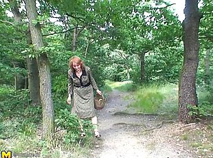 Fascinating matured granny giving big cock blowjob in the forest